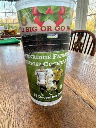 Conference attendees holding branded cups