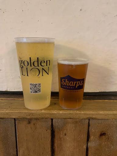 Personalised pint cups being poured