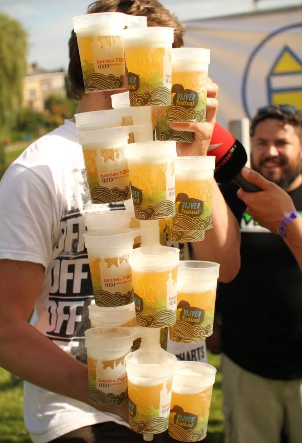 Stack of colourful custom printed festival cups