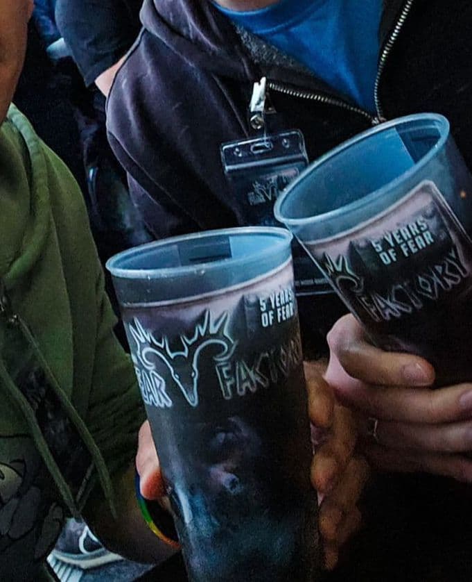 Trays of reusable festival cups counted out for an event bar